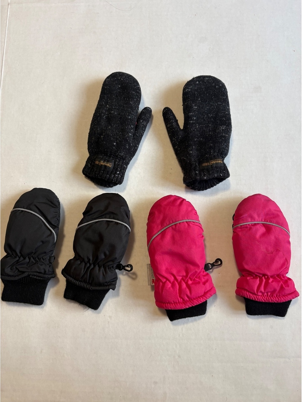Three pairs of kids thinsulate mittens